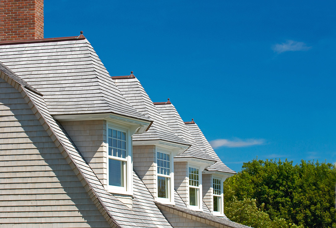 House with a classic shingled roof, showcasing a charming and inviting design in Baltimore, MD