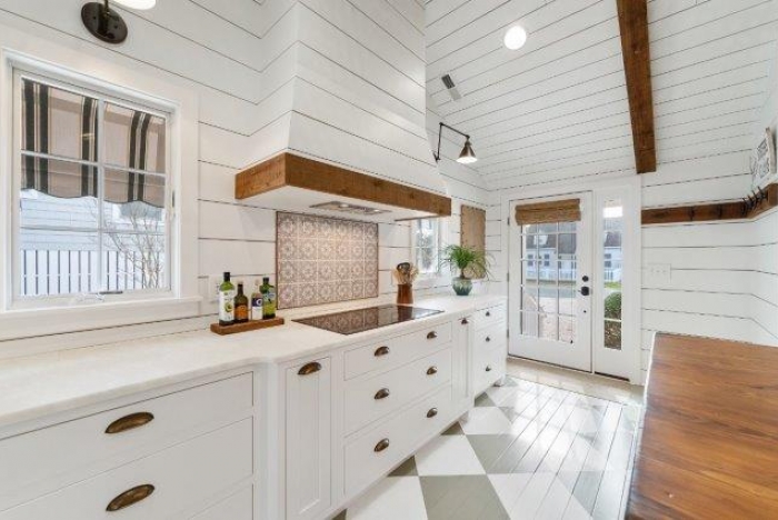 new kitchen installation project with white cabinets and countertops